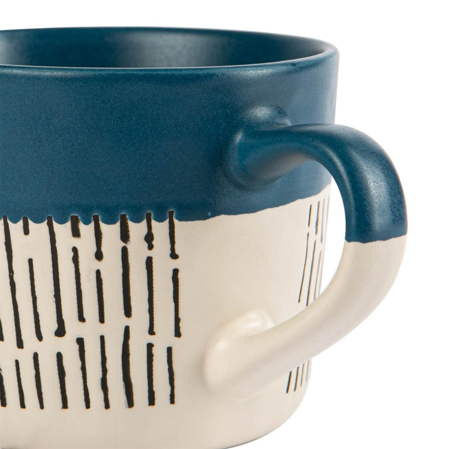 Blue ceramic mug close up dash pattern detail
