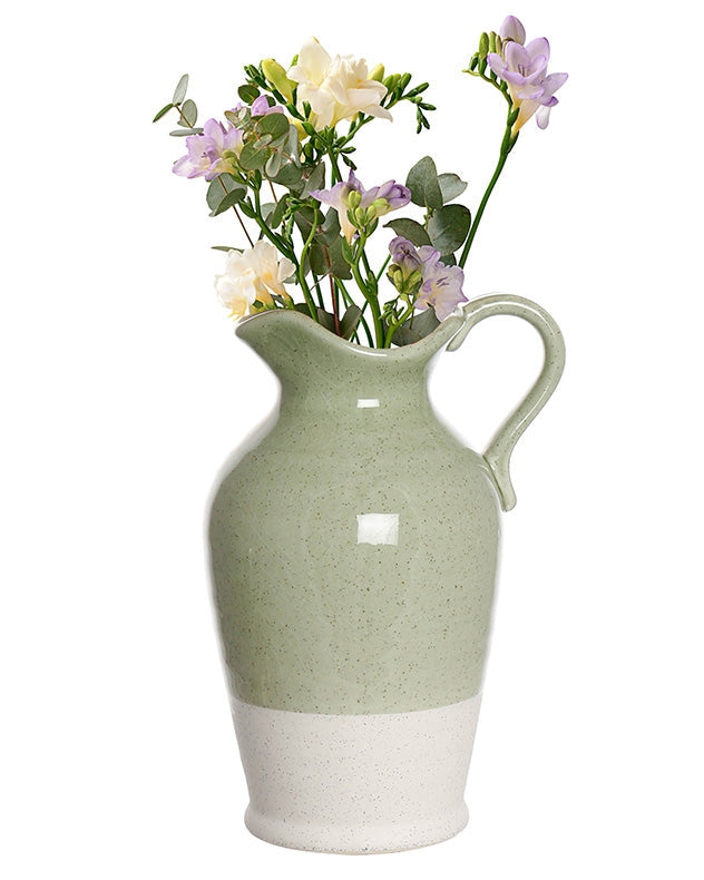 Sage green glazed ceramic jug with flowers