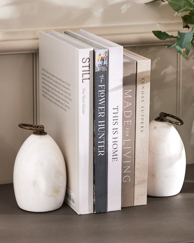 Natural marble bookends styled on shelf with books