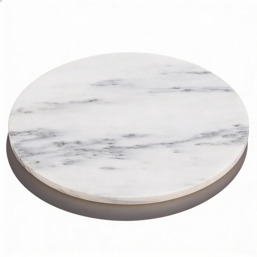 White marble serving board styled on kitchen counter