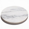 White marble serving board styled on kitchen counter