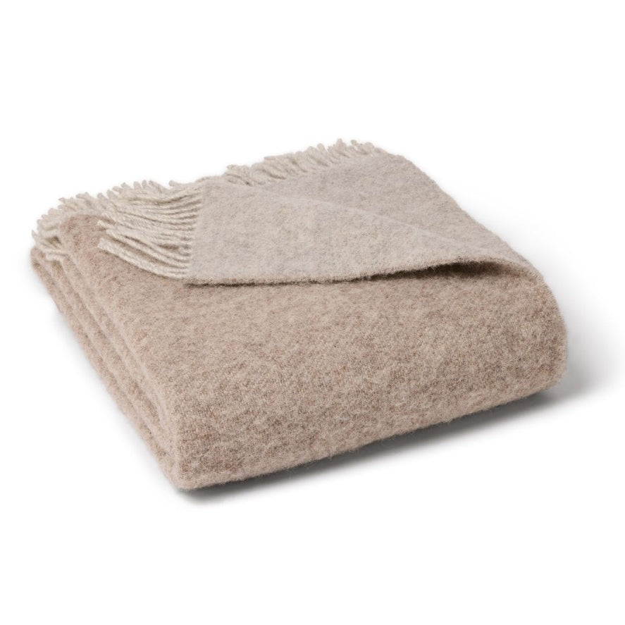 Reversible throw both sides shown pastel and oat